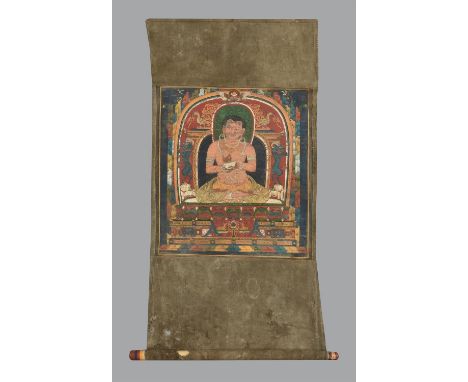 A fine Thang-ka depicting a Mahasiddha, Tibet, pigment on cloth, the figure seated in padmasana on a lotus throne, holding a 