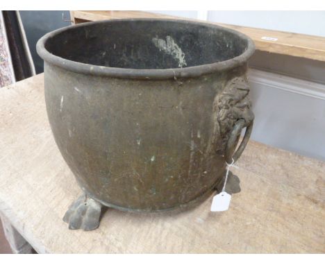 Brass cauldron with lion mask ring handles on paw feet 
