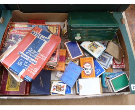 Tin of old marbles, vintage games, playing cards etc 