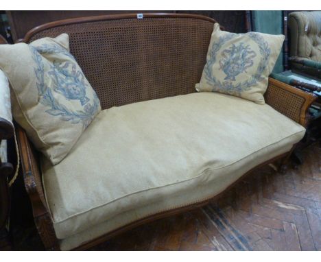 Bergere style fruitwood sofa with gold satin cushions (medallion upholstery Debussy)