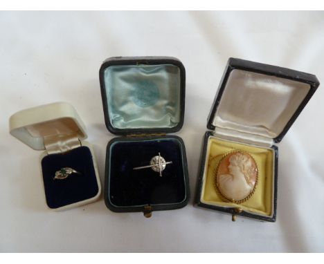 Rolled Cameo brooch, emerald and diamond ring, crucifix pin badge (3) 
