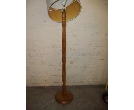 A FLOOR STANDING STANDARD LAMP AND SHADE