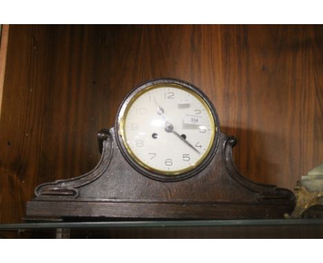 A NAPOLEON HAT MANTEL CLOCK