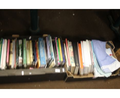 TWO TRAYS OF MISCELLANEOUS BOOKS WITH A FEW CURTAINS (TRAYS NOT INCLUDED)