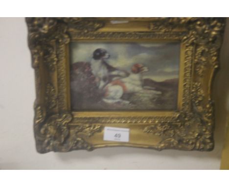 A FRAMED AND GLAZED REPRODUCTION LITHOGRAPH OF DOGS 28 CM X 22 CM
