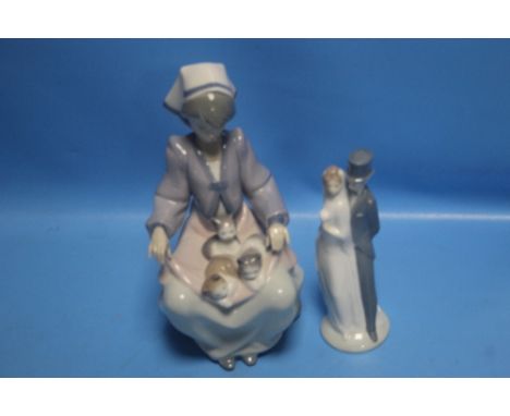 A LLADRO FIGURINE OF A LADY WITH KITTENS TOGETHER WITH A NAO FIGURE GROUP BRIDE &amp; GROOM