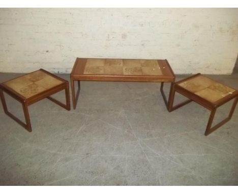A RETRO TEAK TILE TOPPED COFFEE TABLE NEST OF THREE TABLES