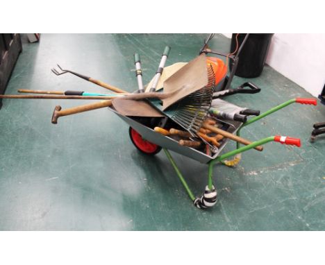 Metal wheelbarrow and garden tools