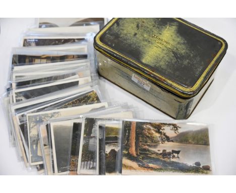 Vintage tin containing postcards of The Lake District, many Abrahams Series cards included 