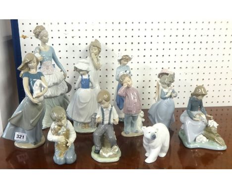 A Lladro polar bear and eleven Nao figures (12)