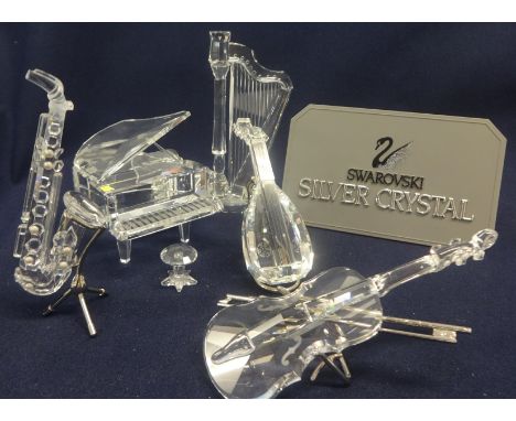 Swarovski Crystal Glass Musical Instruments Collection comprising Saxophone(slight damage), Harp, Violin, Mandolin and Grand 