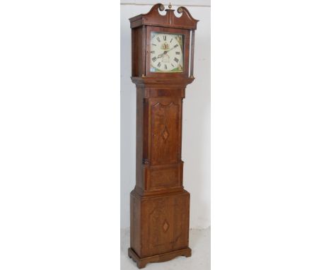 A 19th century George III oak inlaid grandfather clock by W M Chamtler Of Tamworth having brass central finial, swan neck ped