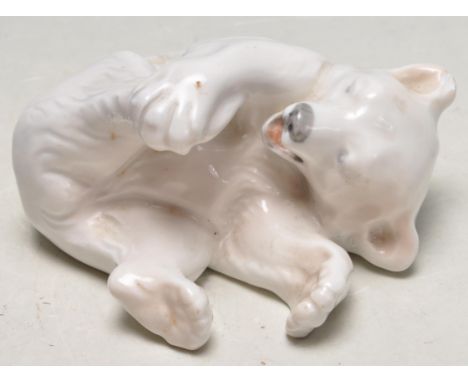 A vintage 20th century Royal Copenhagen polar bear cub figurine. Stamped Royal Copenhagen Denmark to the underside. No 729. S