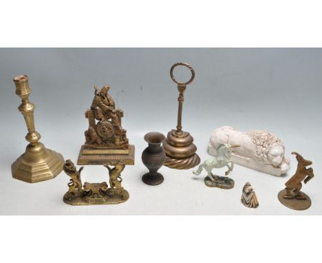 A collection of antique early 20th century brass and stoneware comprising of a lion and unicorn Royal crest for the Monarch o