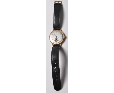 A vintage mid 20th century 9ct Gold Cased Gentleman's Wrist Watch by Trebex with leather strap
