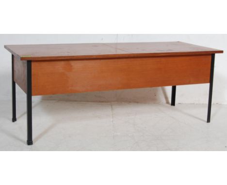 A vintage 1960’s Danish inspired teak wood coffee table in the manner of Myer of a rectangular form with hinged top revealing