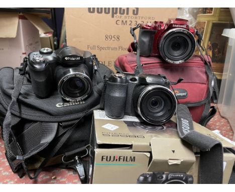 FUJI FINE PIX CAMERA AND A POLAROID CAMERA IN CARRY CASE