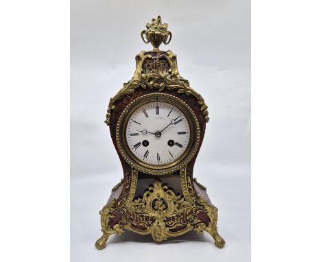 A French boulle mantle clock, gong strike, having signed (indistinctly) white enamel dial with Roman numeral chapter ring and