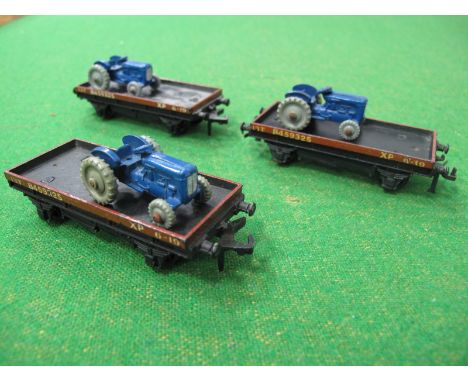 Three Hornby Dublo "OO"Gauge/4mm Flat Wagons, each with Dinky Dublo Massey Harris Tractor, unboxed, condition - wagons fair, 