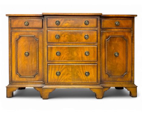 Georgian design mahogany break-front sideboard, fitted with six drawers and two cupboards, on bracket feet Dimensions: Height