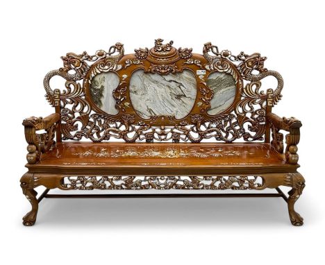 Chinese hardwood three-seat sofa, shaped back inset with three grey marble panels, decorated with carved dragons and birds wi
