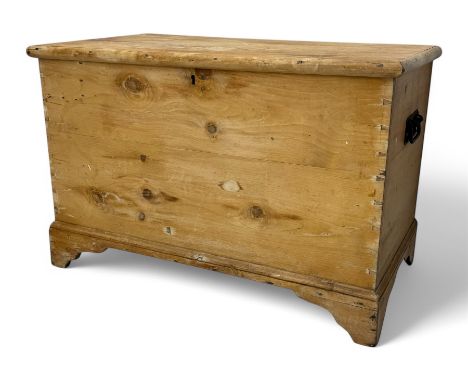 Late 19th century pine coffer, featuring a rectangular hinged lid with moulded edge opening to reveal an interior candle box,