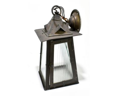 An Arts and Crafts copper plate lantern with four moulded clear glass panels, height 34cm.