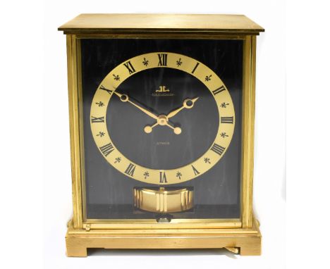 JAEGER LECOULTRE; a gilt brass cased Atmos clock, with marble effect dial and side panels, height 22cm, width 17.5cm, depth 1
