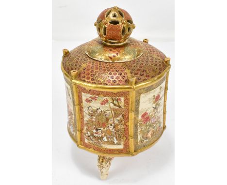 A Japanese Satsuma cylindrical jar and cover, the knop pierced finial above main body with simulated bamboo frame and set wit