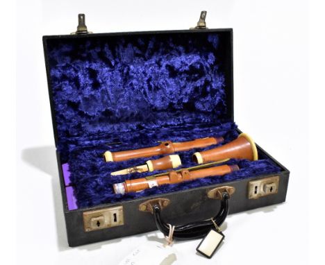 WILLIAM MILHOUSE, LONDON; an early 19th century boxwood clarinet with brass and ivory mounts, length 59cm, cased.Additional I