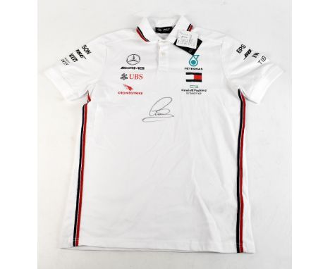 SIR LEWIS HAMILTON; a Mercedes official cotton polo shirt with printed badge and sponsorship logos, signed to front, size S.A