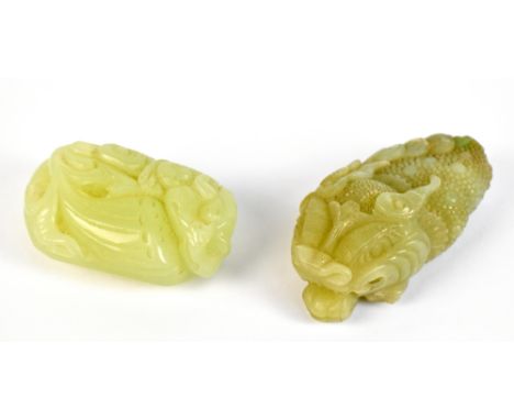 A Chinese jade carving of a dragon's head, length 9.5cm and a pale celadon jade carving, length 7.5cm (2).Additional Informat