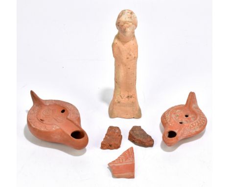 A Christian Roman North African red ware lamp, the central roundel bearing Chi-Rho monogram within stylised border, circa 4th