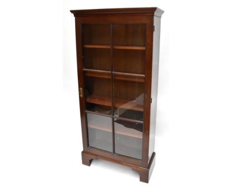 A 20th century mahogany single door display cabinet raised on bracket feet, width 83cm.Additional InformationGeneral surface 