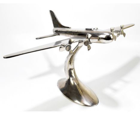 A large chromed tabletop model aeroplane on oval base, height 42cm, width 80cm, depth 47cm.Additional InformationSome light g