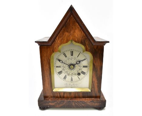 THOMAS COX SAVORY OF 47 CORNHILL LONDON; a 19th century rosewood cased Gothic Revival mantel clock, the silvered dial set wit