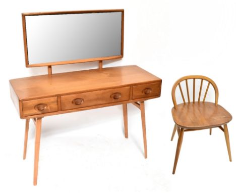 ERCOL; a 1950s medium elm mirror back dressing table, model no.406, with three central drawers raised on tapering block suppo