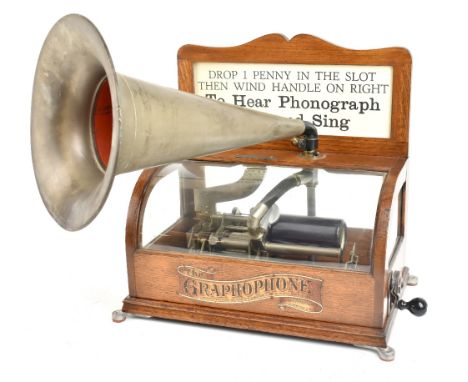 COLUMBIA PHONOGRAPH CO; a coin operated Type BS No.507514 graphophone, the hinged glazed top with applied decorative label in