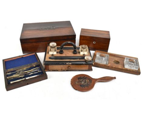 A 19th century brass bound rosewood writing slope (af), length 35.5cm, together with a rosewood tea caddy, two desk stands wi