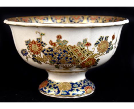 A Japanese Satsuma footed bowl, both internally and externally decorated with a deep blue on cream ground, signed with Imperi