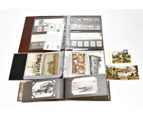 Two albums containing various continental and British postcards, relating to various areas of France and Buxton, together wit