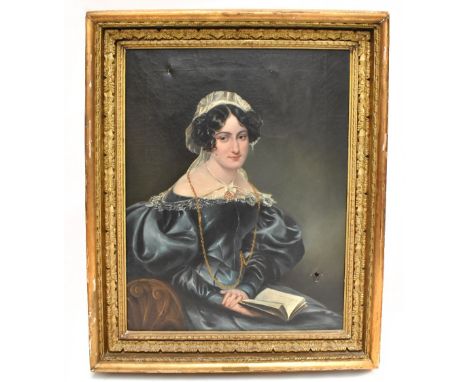 CHARLES DUKES (1803-1865); oil on canvas, portrait of a young woman holding a book, inscribed to the canvas verso ‘Chas Dukes