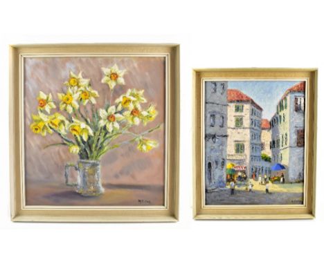 N S COLE; two oils on board, the first depicting a Continental market scene, the second a floral still life, both signed lowe