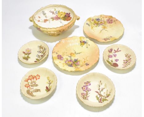 ROYAL WORCESTER; a blush ivory twin handled bowl decorated with floral sprays, raised on four scrolling feet, diameter 28cm, 