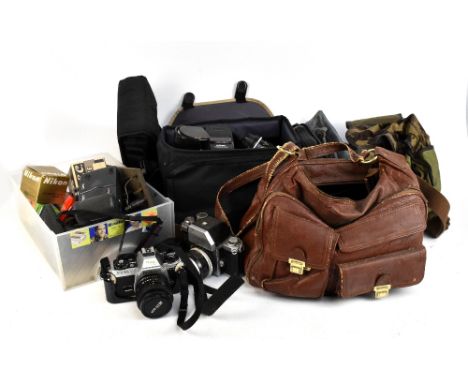NIKON; an F camera with Nikkor-S Auto 1:2.8 f=35mm, an FG-20 camera with Series E 35mm 1:2.5 lens, further lenses including S