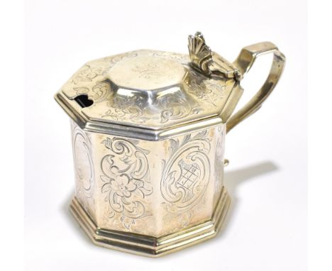 GEORGE TURNER (PROBABLY); a Victorian hallmarked silver octagonal lidded mustard with chased scrolling floral decoration surr