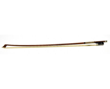 A German violoncello bow with nickel mounts and mother of pearl dot inlay, length 71cm.