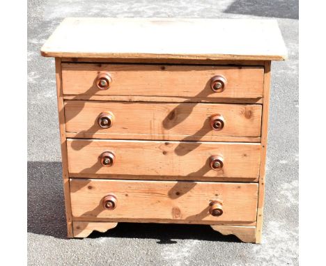 An old pine chest of four drawers, raised on bracket feet, length 84.5cm, depth 48cm, height 75cm.