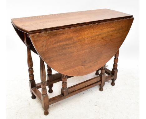 A small oak drop leaf gate leg table.