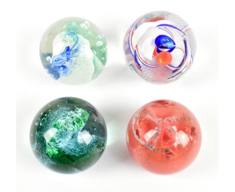 CAITHNESS; four assorted glass paperweights to include an example number 36632.